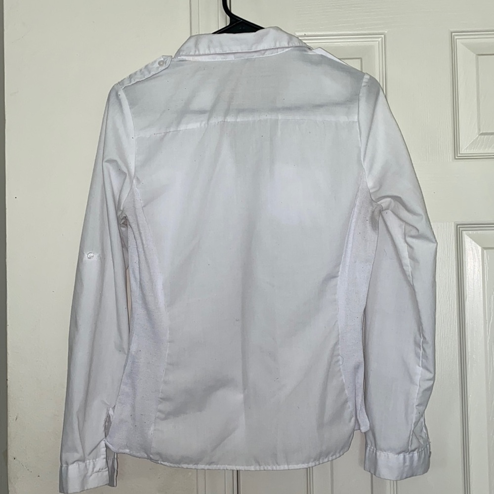 A white button down business casual shirt